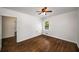 Bright bedroom with hardwood floors, white walls, and natural light at 1150 Kennesaw Due West Nw Rd, Kennesaw, GA 30152