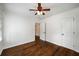 Bedroom with hardwood floors, white walls, and doors at 1150 Kennesaw Due West Nw Rd, Kennesaw, GA 30152