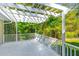 A sun-drenched covered porch creates a cozy outdoor space, enhanced by hanging plants and decorative railings at 1150 Kennesaw Due West Nw Rd, Kennesaw, GA 30152