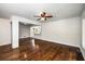 Open living room with hardwood floors that connects to the kitchen and dining area at 1150 Kennesaw Due West Nw Rd, Kennesaw, GA 30152