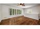 Sun-filled living room features refinished hardwood floors and large windows with great lighting at 1150 Kennesaw Due West Nw Rd, Kennesaw, GA 30152