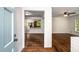Inviting living room and kitchen with beautiful hardwood floors and an open concept at 1150 Kennesaw Due West Nw Rd, Kennesaw, GA 30152