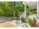 Inviting front porch features stairs with decorative plants, and wood deck at 1150 Kennesaw Due West Nw Rd, Kennesaw, GA 30152