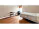 Bedroom featuring wood flooring and view of the backyard through the window at 245 Vaness Dr, Mcdonough, GA 30253