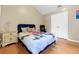 Bright bedroom featuring light colored walls and laminate wood flooring at 245 Vaness Dr, Mcdonough, GA 30253