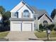 Charming two-story home with a two-car garage and well-manicured lawn at 245 Vaness Dr, Mcdonough, GA 30253