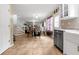 Kitchen with stainless steel appliances and open view to dining area and stairs at 245 Vaness Dr, Mcdonough, GA 30253