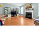 Bright living room with fireplace and built in display cabinets at 245 Vaness Dr, Mcdonough, GA 30253