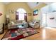 Comfortable living room with hardwood floors, high ceilings, and lots of natural light at 245 Vaness Dr, Mcdonough, GA 30253
