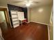Bedroom featuring a desk, bookshelf, ceiling fan, and hardwood floors at 3753 Soapstone Rd, Decatur, GA 30034