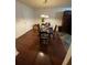 Elegant dining room with hardwood floors, stylish light fixture, and modern decor at 3753 Soapstone Rd, Decatur, GA 30034