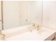Bathroom features a double sink vanity with modern faucets, ample counterspace and a large mirror at 4448 Tacoma Trce, Suwanee, GA 30024