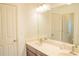 Double vanity bathroom with two sinks, large mirror, modern lighting, and neutral color scheme at 4448 Tacoma Trce, Suwanee, GA 30024