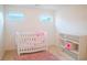 Adorable Bedroom with crib, plush rug, and plenty of natural light, perfect for a new Gathering at 4448 Tacoma Trce, Suwanee, GA 30024
