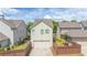 A charming home shows a two-car garage and a small landscaped yard at 4448 Tacoma Trce, Suwanee, GA 30024