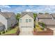 A charming home shows a two-car garage and a small landscaped yard at 4448 Tacoma Trce, Suwanee, GA 30024