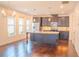 Spacious kitchen with stainless steel appliances, granite countertops, and hardwood floors at 4448 Tacoma Trce, Suwanee, GA 30024