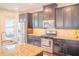 Kitchen featuring stainless steel appliances, granite countertops and a large island at 4448 Tacoma Trce, Suwanee, GA 30024