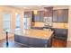 Kitchen featuring stainless steel appliances, granite countertops and a large island at 4448 Tacoma Trce, Suwanee, GA 30024
