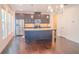 Spacious kitchen with stainless steel appliances, granite countertops, and hardwood floors at 4448 Tacoma Trce, Suwanee, GA 30024