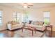Bright and airy living room with hardwood floors, neutral walls, and stylish furnishings at 4448 Tacoma Trce, Suwanee, GA 30024