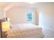 Bright bedroom featuring a comfortable bed, a window, and a cozy, welcoming atmosphere at 4448 Tacoma Trce, Suwanee, GA 30024