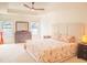 Spacious main bedroom with tray ceiling, neutral walls, and a cozy sitting area at 4448 Tacoma Trce, Suwanee, GA 30024