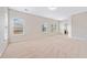 Spacious bedroom with plush carpet, neutral walls, and natural light from multiple windows at 4920 Fourth Rail Ln, Cumming, GA 30040