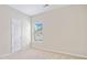 Bright bedroom with plush carpet, fresh neutral walls, and a large window at 4920 Fourth Rail Ln, Cumming, GA 30040