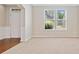 Open-concept living room with a seamless transition to hardwood floors at 4920 Fourth Rail Ln, Cumming, GA 30040