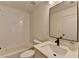 Full bathroom complete with modern tile and vanity with brushed black fixtures at 1006 Fendley St, Woodstock, GA 30188