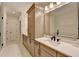Long bathroom featuring modern cabinets and white countertops at 1006 Fendley St, Woodstock, GA 30188