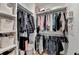 Closet with three tiers of shelving and a clothes rod at 1006 Fendley St, Woodstock, GA 30188