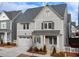 Charming two-story home with neutral siding, stylish shutters, and a two-car garage in a desirable community at 1006 Fendley St, Woodstock, GA 30188
