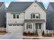 Charming two-story home with neutral siding, stylish shutters, and a two-car garage in a desirable community at 1006 Fendley St, Woodstock, GA 30188