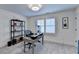 Comfortable home office with ample natural light, stylish shelving, and modern decor at 1006 Fendley St, Woodstock, GA 30188