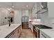 Bright, updated kitchen features a large island, stainless steel refrigerator, and modern appliances at 1006 Fendley St, Woodstock, GA 30188