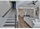 Inviting living space features a staircase, dining area, and access to a well-equipped kitchen at 1006 Fendley St, Woodstock, GA 30188