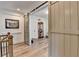 Open-concept living room featuring barn doors, wooden floors, elegant furniture, and tasteful decor, radiating comfort at 1006 Fendley St, Woodstock, GA 30188