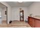 Well-lit living room featuring hardwood floors, display cabinet and credenza, creating a spacious and inviting atmosphere at 1006 Fendley St, Woodstock, GA 30188