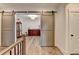 Open-concept living room with barn doors, wooden floors, and elegant furniture, creating a warm and inviting space at 1006 Fendley St, Woodstock, GA 30188