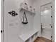 Charming mudroom with built-in bench, storage cubbies, and convenient access to the bathroom at 1006 Fendley St, Woodstock, GA 30188