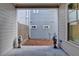 Narrow yard between houses, statues and a peek at the neighbor's house at 1006 Fendley St, Woodstock, GA 30188