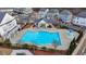 Aerial view of the community pool, perfect for relaxing and enjoying the outdoors in a vibrant setting at 1006 Fendley St, Woodstock, GA 30188
