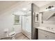 Stylish bathroom featuring a shower-over-tub, white vanity, and modern gray and white wall tiles at 1523 Pangborn Station Dr, Decatur, GA 30033