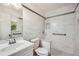 Bathroom featuring marble tile, walk-in shower, and modern vanity at 1523 Pangborn Station Dr, Decatur, GA 30033