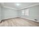 Bedroom featuring fresh paint, laminate flooring, and crown molding at 1523 Pangborn Station Dr, Decatur, GA 30033