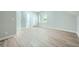 Bedroom featuring three doors, one window, and wood-look flooring at 1523 Pangborn Station Dr, Decatur, GA 30033