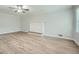 Spacious living room featuring light gray walls, fireplace and light wood laminate flooring at 1523 Pangborn Station Dr, Decatur, GA 30033