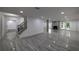 Finished basement with wood-look flooring, fireplace, staircase and exterior access at 4 Bentley Trace Mnr, Atlanta, GA 30327